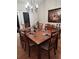 Formal dining area with a spacious wooden table, seating for eight, and elegant decor at 2409 Victory Palm Dr, Edgewater, FL 32141