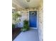 Inviting front entrance showcasing a blue front door with a decorative wreath at 2409 Victory Palm Dr, Edgewater, FL 32141