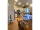 Well-lit kitchen featuring stainless steel appliances, white cabinetry, and a convenient breakfast bar at 2409 Victory Palm Dr, Edgewater, FL 32141