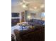 Cozy living room showcasing comfortable seating, neutral decor, and a traditional grandfather clock at 2409 Victory Palm Dr, Edgewater, FL 32141