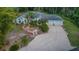 Stunning single Gathering home with lush landscaping, a paved driveway, and attached two-car garage at 2576 Shilo Glynn Ln, New Smyrna Beach, FL 32168
