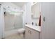 Well-lit bathroom with a shower-tub combo, vanity sink, and clean, bright finishes at 2576 Shilo Glynn Ln, New Smyrna Beach, FL 32168
