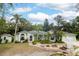 Charming single-story home with lush landscaping and a stone pathway leading to the front door at 2576 Shilo Glynn Ln, New Smyrna Beach, FL 32168