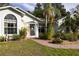 Close up exterior featuring a well-manicured lawn and pathway leading to the home's entrance at 2576 Shilo Glynn Ln, New Smyrna Beach, FL 32168