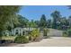 Charming single-story home with lush landscaping, mature trees, and an attached two-car garage at 2576 Shilo Glynn Ln, New Smyrna Beach, FL 32168