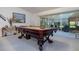 Relaxing game room featuring a pool table and sliding glass doors to the lanai at 2576 Shilo Glynn Ln, New Smyrna Beach, FL 32168