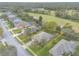 An aerial view shows the property lines on a well-kept house and yard that backs onto a golf course at 2626 Turnbull Estates Dr, New Smyrna Beach, FL 32168