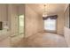 Dining room featuring a chandelier, large window, and neutral carpet at 2626 Turnbull Estates Dr, New Smyrna Beach, FL 32168