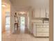 Inviting entryway with tile flooring, view of living area, and convenient access to the kitchen at 2626 Turnbull Estates Dr, New Smyrna Beach, FL 32168