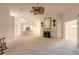 Spacious living room with fireplace and adjacent kitchen, perfect for entertaining guests at 2626 Turnbull Estates Dr, New Smyrna Beach, FL 32168