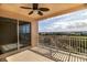 Relaxing balcony featuring a ceiling fan and picturesque views of the landscape and the blue, sunny sky at 265 Minorca Beach Way # 505, New Smyrna Beach, FL 32169