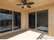 Spacious balcony with ceiling fan and sliding glass doors at 265 Minorca Beach Way # 505, New Smyrna Beach, FL 32169