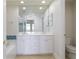 Bathroom vanity with a large mirror, double sinks, and a tub at 265 Minorca Beach Way # 505, New Smyrna Beach, FL 32169