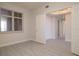 Bright bedroom with gray floors, window view and white walls at 265 Minorca Beach Way # 505, New Smyrna Beach, FL 32169