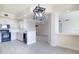 Bright modern kitchen features white cabinetry, stylish countertops, black appliances and stainless steel faucet at 265 Minorca Beach Way # 505, New Smyrna Beach, FL 32169