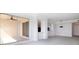 Bright and airy living room with access to a private balcony, tile floors, and modern light fixtures at 265 Minorca Beach Way # 505, New Smyrna Beach, FL 32169