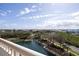 Picturesque view from the balcony overlooking a lake and lush landscape at 265 Minorca Beach Way # 505, New Smyrna Beach, FL 32169