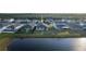 Aerial view of a home near the water, showcasing the lake view and community amenities at 2820 Neverland Dr, New Smyrna Beach, FL 32168