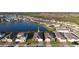 Community aerial view featuring a beautiful lakeside home, showcasing its desirable location in a thriving neighborhood at 2820 Neverland Dr, New Smyrna Beach, FL 32168