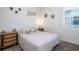 Cozy bedroom featuring neutral decor, side tables, and nautical-themed artwork, creating a relaxing atmosphere at 2820 Neverland Dr, New Smyrna Beach, FL 32168