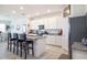 Modern kitchen with granite countertops, stainless steel appliances, and bar seating at 2820 Neverland Dr, New Smyrna Beach, FL 32168