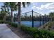 Community pickleball courts surrounded by lush landscaping and fencing, providing a private and enjoyable setting at 2820 Neverland Dr, New Smyrna Beach, FL 32168