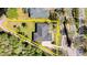 An aerial view of this home showing the property line highlighting its spacious, verdant surroundings at 29 Promenade At Lionspaw, Daytona Beach, FL 32124