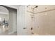 Bright bathroom features white tile shower with built-in shelving and neutral tile accents at 29 Promenade At Lionspaw, Daytona Beach, FL 32124