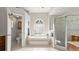 Bright bathroom featuring a soaking tub, glass-enclosed shower, and modern fixtures for a spa-like experience at 29 Promenade At Lionspaw, Daytona Beach, FL 32124