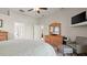 Cozy bedroom features a warm color scheme, a TV on the wall, and an ensuite bathroom for added convenience at 29 Promenade At Lionspaw, Daytona Beach, FL 32124
