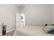 Neutral bedroom featuring cozy bedding, and an open doorway leading to the closet and en suite bathroom at 29 Promenade At Lionspaw, Daytona Beach, FL 32124
