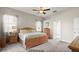 Bright bedroom showcasing neutral tones, ample natural light, and well-placed furniture for a comfortable setting at 29 Promenade At Lionspaw, Daytona Beach, FL 32124