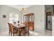 Cozy dining room featuring a wooden table, chandelier, and a view of the kitchen at 29 Promenade At Lionspaw, Daytona Beach, FL 32124