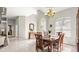 Bright dining room with a traditional table set, arched windows, and neutral décor at 29 Promenade At Lionspaw, Daytona Beach, FL 32124