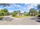 This single-story home features lush landscaping, mature trees, and a brick-paved street at 29 Promenade At Lionspaw, Daytona Beach, FL 32124