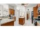 Well-equipped kitchen featuring granite countertops, an island, and modern appliances at 29 Promenade At Lionspaw, Daytona Beach, FL 32124