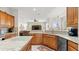 Well-lit kitchen boasts granite counters, a breakfast bar, and modern appliances at 29 Promenade At Lionspaw, Daytona Beach, FL 32124