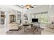 Spacious living room boasts neutral decor, tray ceilings, and large windows for natural light at 29 Promenade At Lionspaw, Daytona Beach, FL 32124