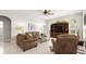Bright living room featuring tile flooring, comfortable seating, and a built-in entertainment center with natural light at 29 Promenade At Lionspaw, Daytona Beach, FL 32124