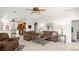Spacious living room with tile flooring, ample seating, and an open layout connecting to the kitchen at 29 Promenade At Lionspaw, Daytona Beach, FL 32124