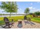 Backyard patio with lake view and comfortable seating arrangement at 2943 Gibraltar Blvd, New Smyrna Beach, FL 32168