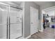 Modern bathroom featuring a glass shower, a door, and a walk-in closet at 2943 Gibraltar Blvd, New Smyrna Beach, FL 32168