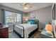 Comfortable bedroom with a metal bed frame, neutral walls, and plenty of natural light at 2943 Gibraltar Blvd, New Smyrna Beach, FL 32168