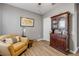 Comfortable bedroom with an accent chair and dark wood cabinet for extra storage space at 2943 Gibraltar Blvd, New Smyrna Beach, FL 32168