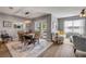 Cozy dining room featuring a modern chandelier, sliding door access to the backyard, and adjacent living area at 2943 Gibraltar Blvd, New Smyrna Beach, FL 32168