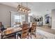 Dining room with backyard access, an open layout to the living area, and stylish furnishings for comfortable entertaining at 2943 Gibraltar Blvd, New Smyrna Beach, FL 32168
