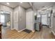 Foyer with hardwood flooring, a bench, and view to the living room and front door at 2943 Gibraltar Blvd, New Smyrna Beach, FL 32168
