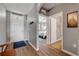 Cozy entrance hall with hardwood floors, neutral walls, and view to the bedroom at 2943 Gibraltar Blvd, New Smyrna Beach, FL 32168