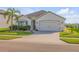 Attractive single-Gathering home with manicured lawn, tidy landscaping, and a neutral color palette at 2943 Gibraltar Blvd, New Smyrna Beach, FL 32168