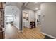 Hallway with an arched entryway and a view of the laundry room and living area at 2943 Gibraltar Blvd, New Smyrna Beach, FL 32168
